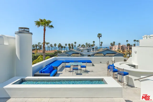 a view of living room with furniture and potted plants