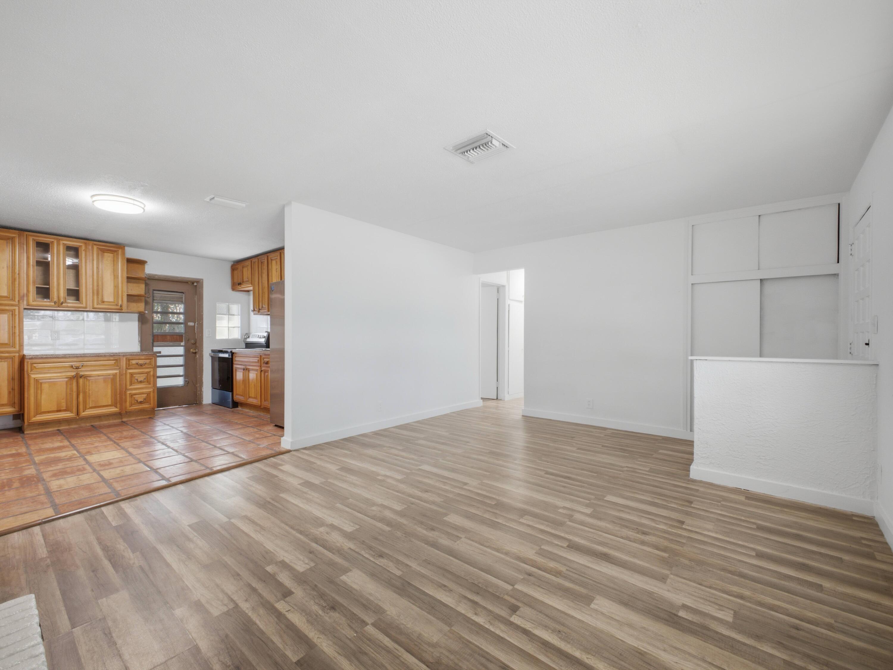 6700 Forest Court West Palm Beach, FL 33405 - Photo 37 of 45 Living to Kitchen
