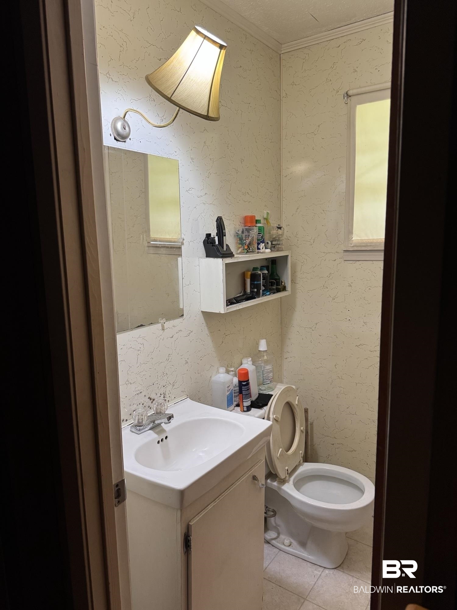 15760 Pine Grove Rd Extension West Bay Minette, AL 36507 - Photo 9 of 22 Bathroom with tile patterned floors, vanity, toilet, a textured wall, and crown molding