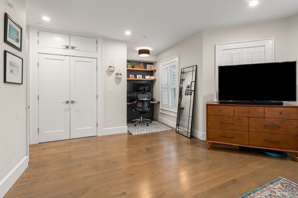 654 East 7th Street, Unit 3 Boston, MA 02127 - Photo 16 of 28 a view of a livingroom with furniture and a flat screen tv