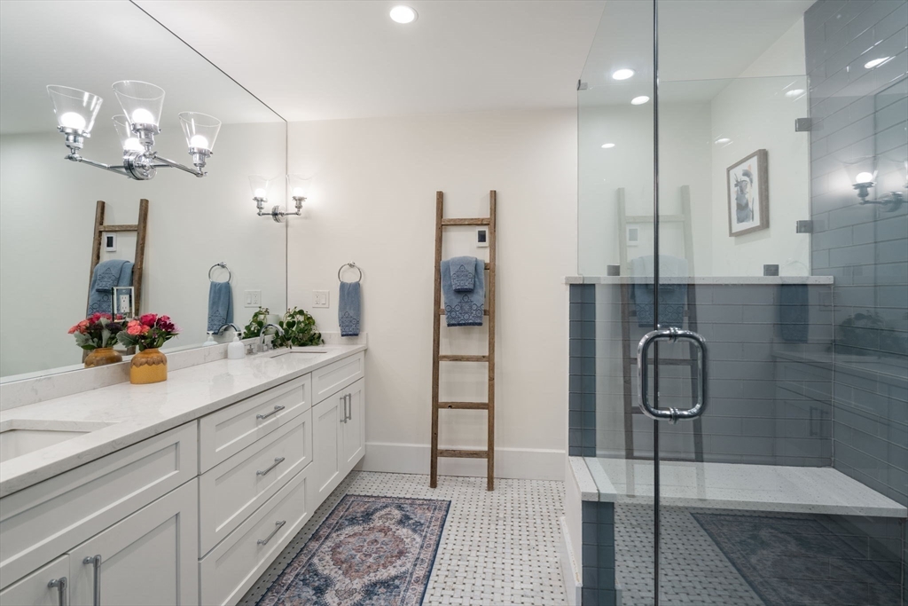 654 East 7th Street, Unit 3 Boston, MA 02127 - Photo 18 of 28 a spacious bathroom with a double vanity sink mirror and shower