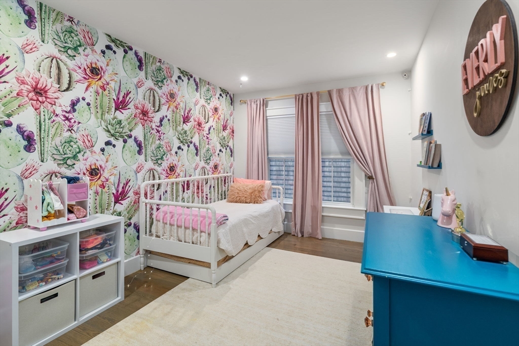 654 East 7th Street, Unit 3 Boston, MA 02127 - Photo 20 of 28 a bedroom with bed and a painting on the wall