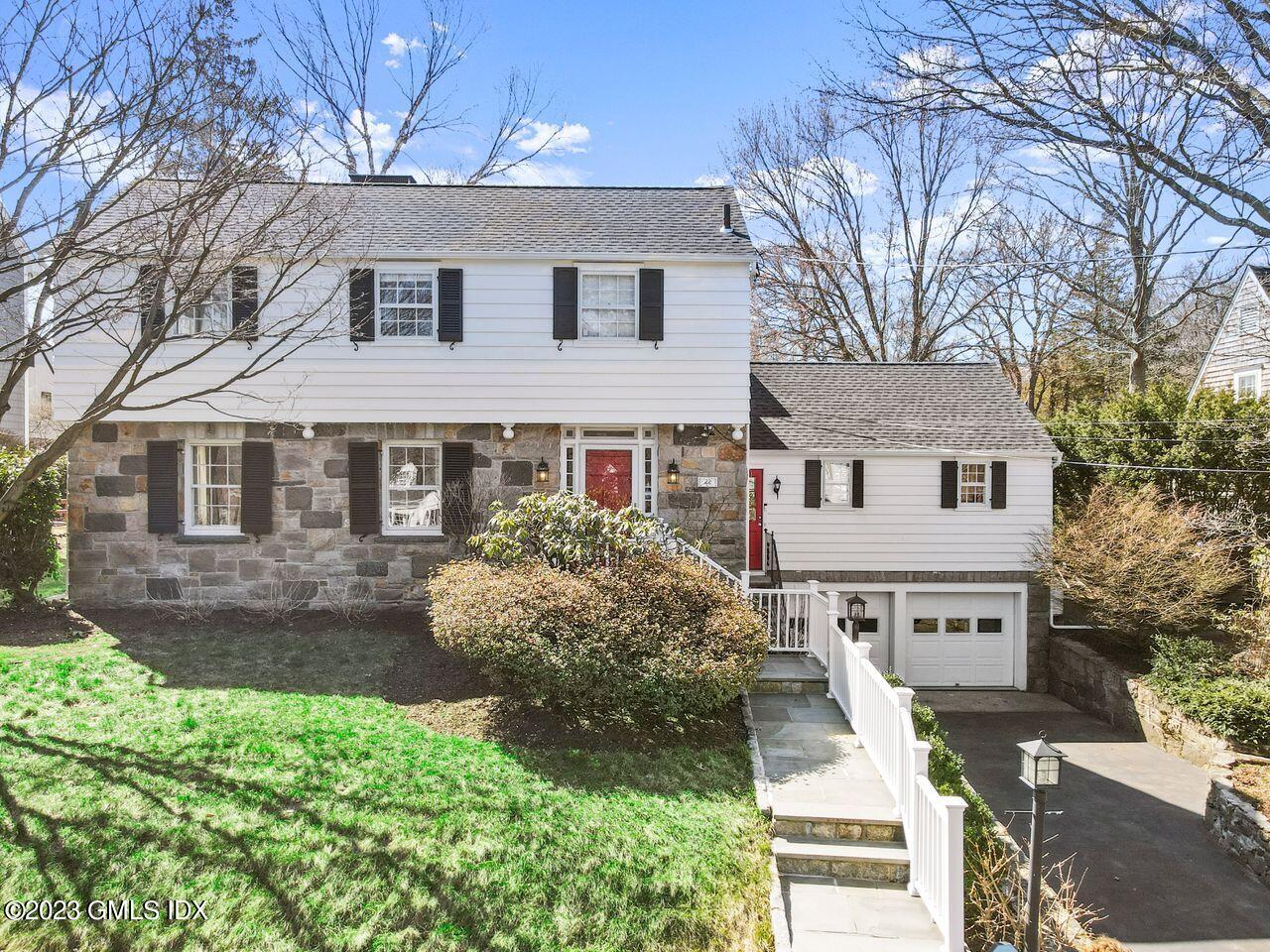 22 Linwood Avenue Riverside, CT 06878 - Photo 1 of 37 a front view of a house with a yard