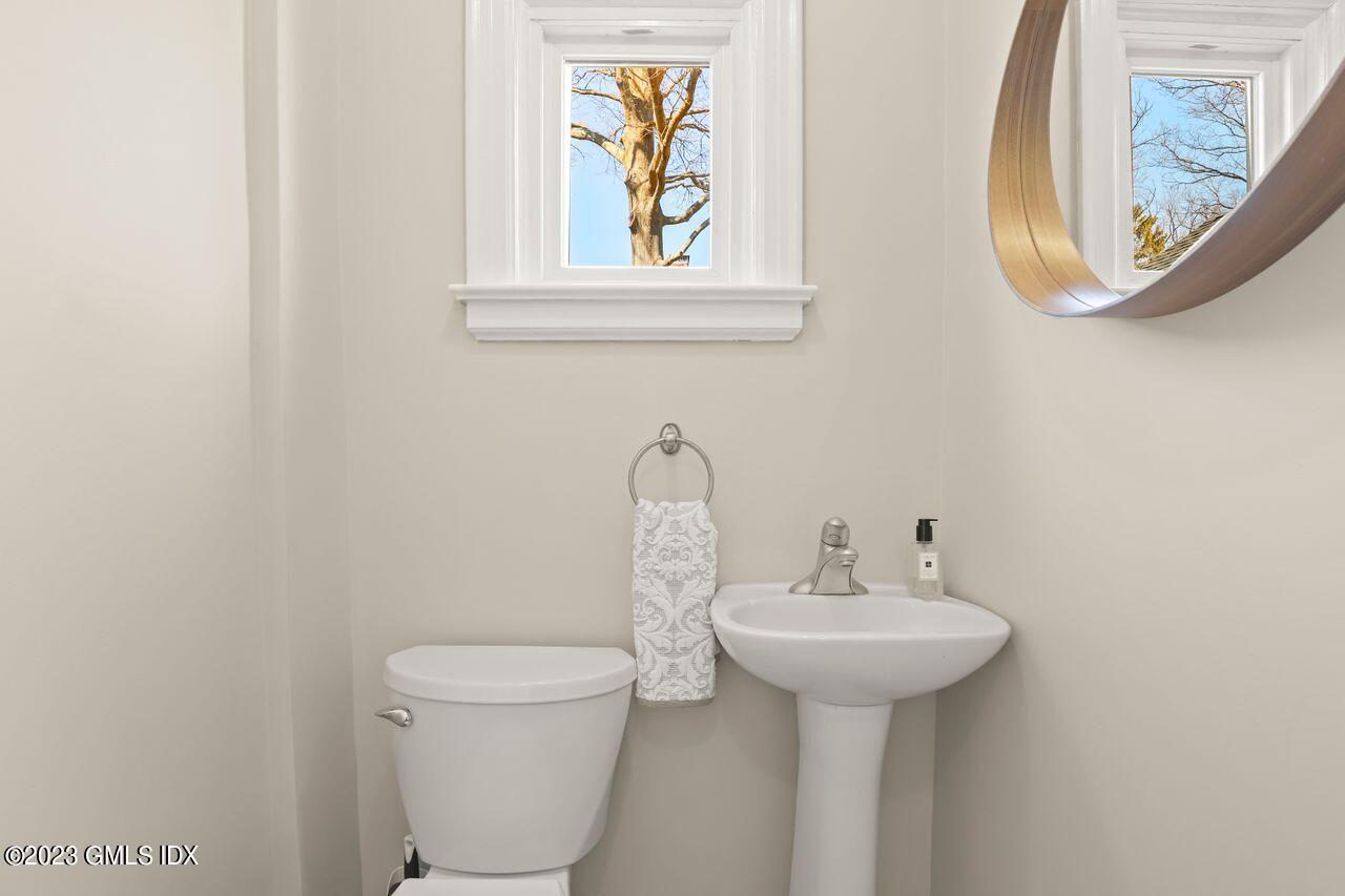 22 Linwood Avenue Riverside, CT 06878 - Photo 16 of 37 a bathroom with a toilet sink and mirror