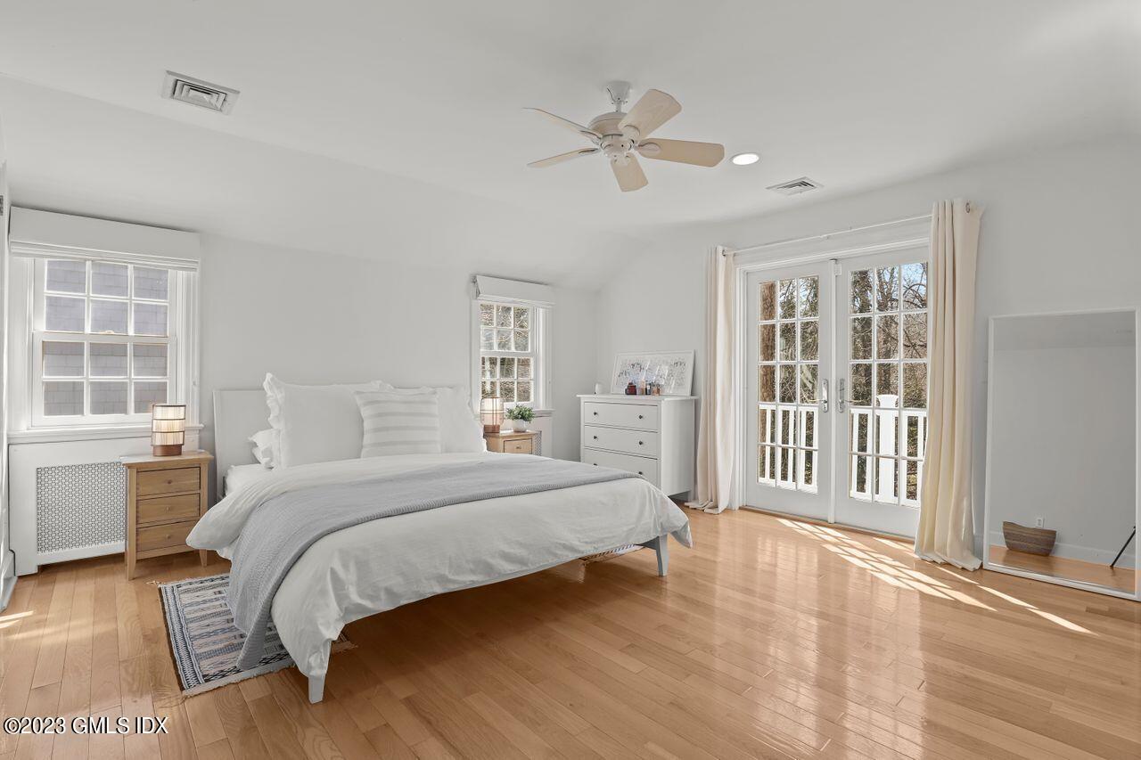 22 Linwood Avenue Riverside, CT 06878 - Photo 17 of 37 a bedroom with a large bed and a window
