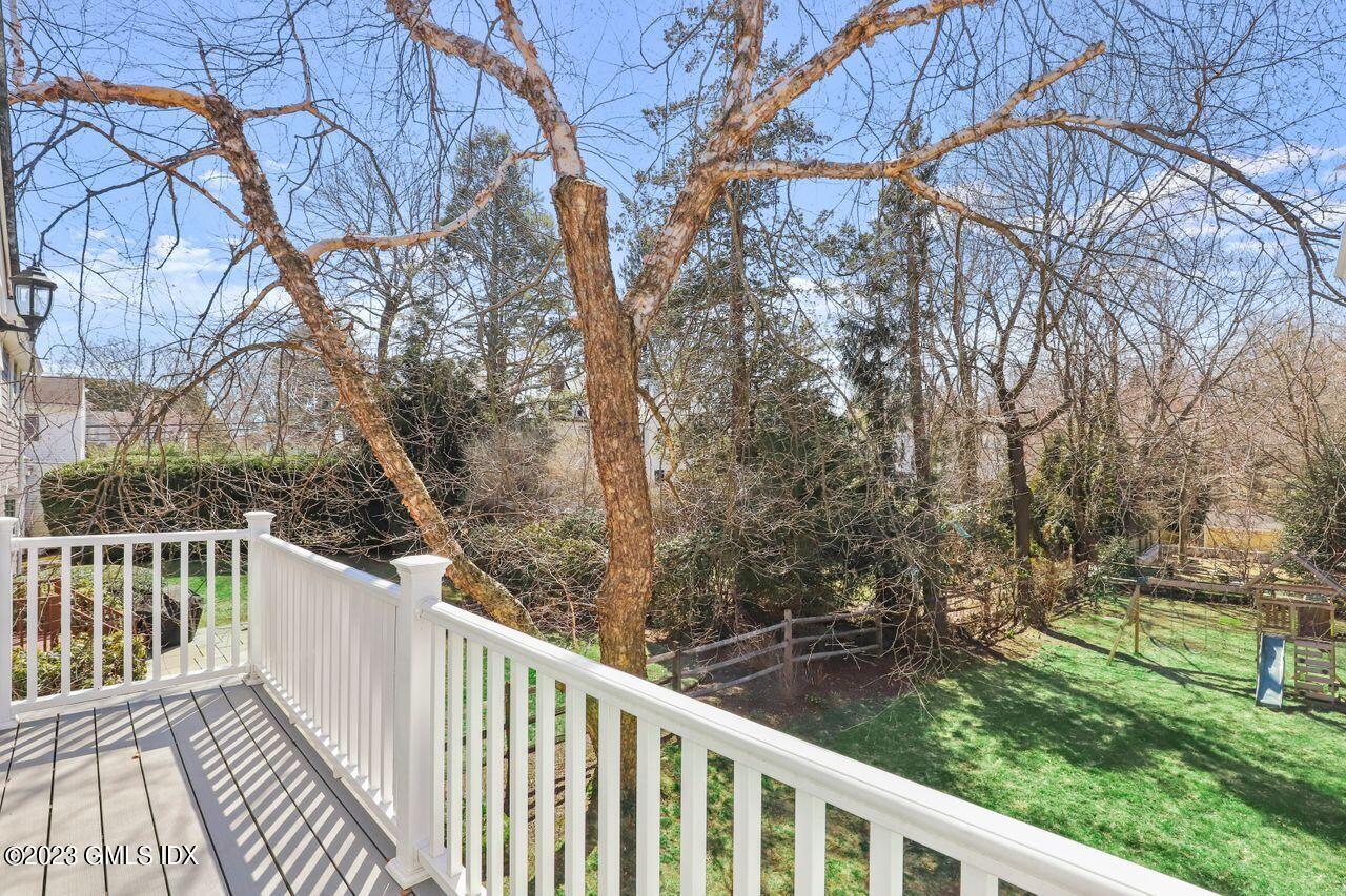 22 Linwood Avenue Riverside, CT 06878 - Photo 20 of 37 a view of a wooden deck next to a yard