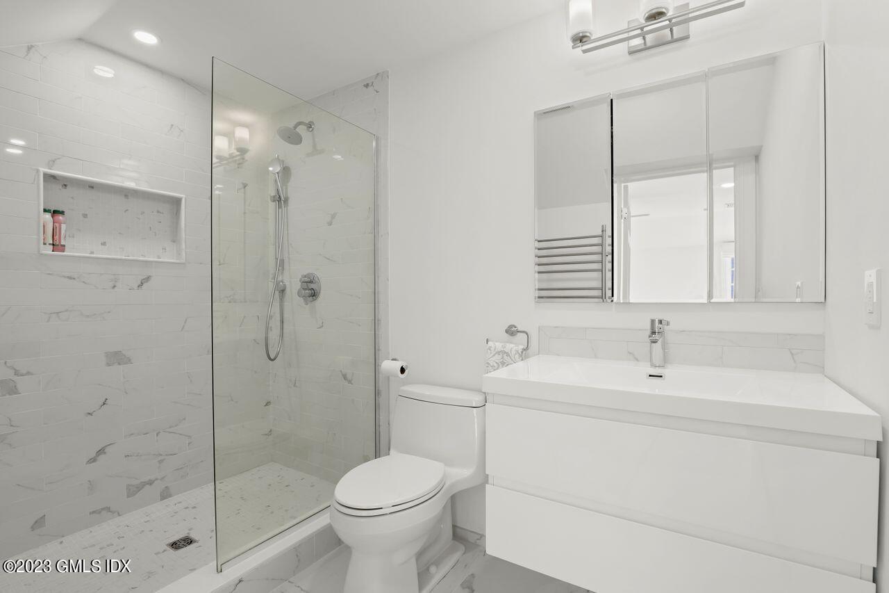22 Linwood Avenue Riverside, CT 06878 - Photo 21 of 37 a bathroom with a sink toilet and shower