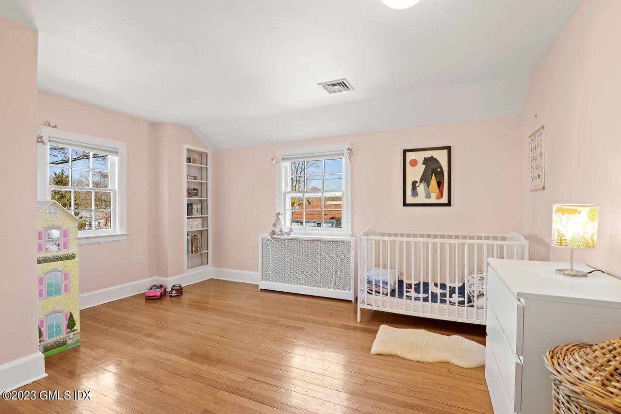 22 Linwood Avenue Riverside, CT 06878 - Photo 24 of 37 a bedroom with furniture and a window