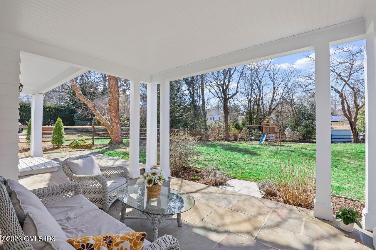 22 Linwood Avenue Riverside, CT 06878 - Photo 31 of 37 a view of a patio with table and chairs potted plants with large tree