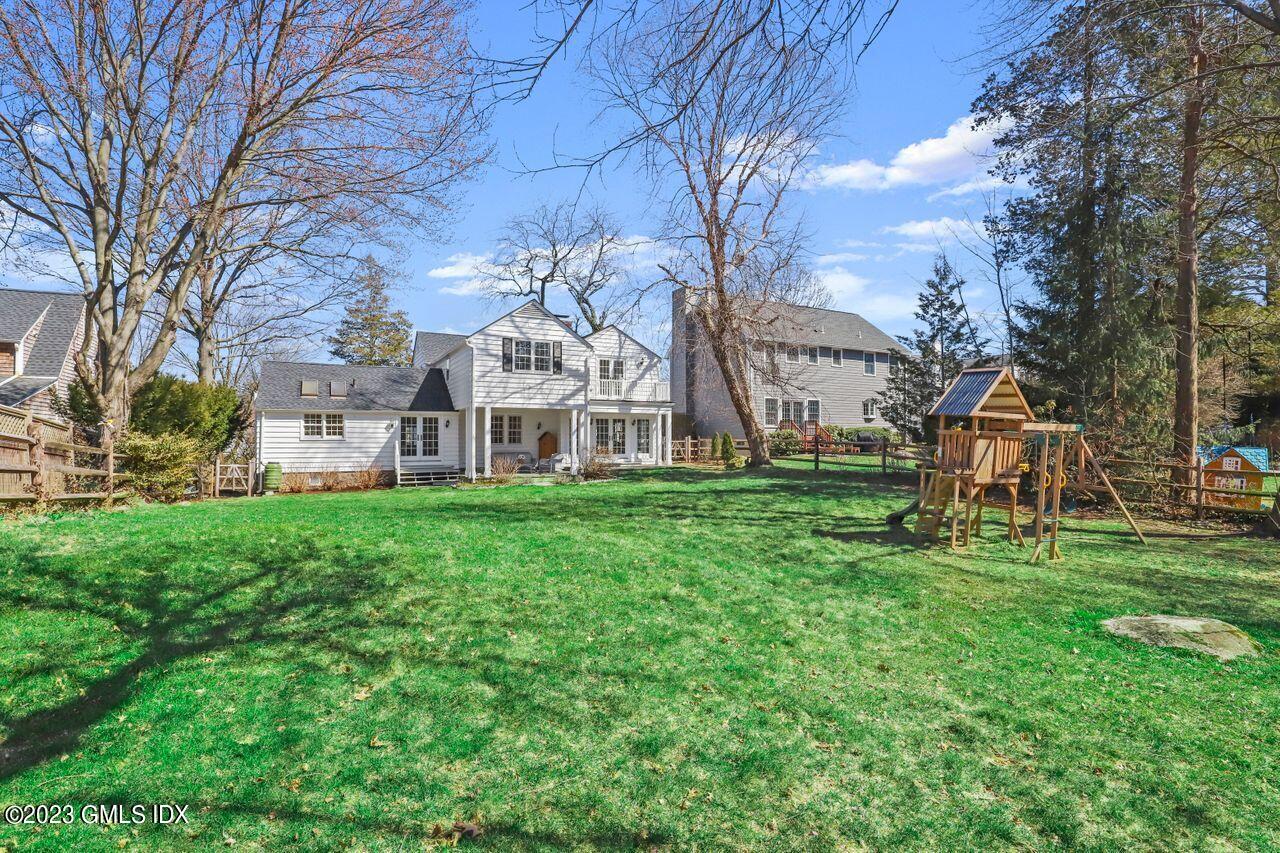 22 Linwood Avenue Riverside, CT 06878 - Photo 33 of 37 a view of a house with a yard