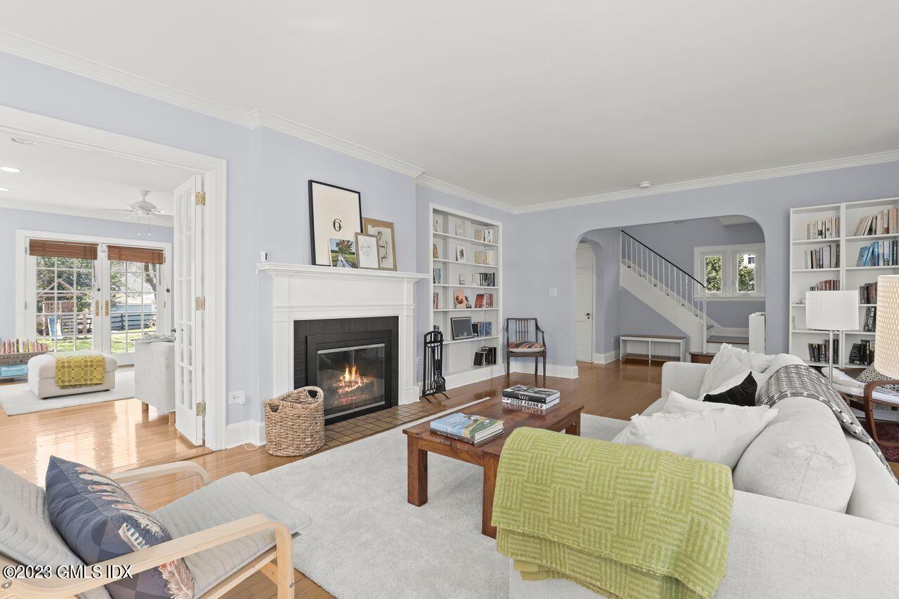 22 Linwood Avenue Riverside, CT 06878 - Photo 6 of 37 a living room with furniture large window and a fireplace