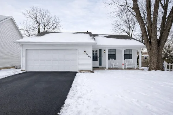 front view of a house with a yard