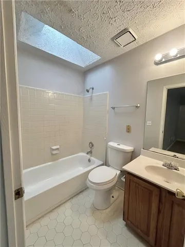 an empty room with a empty space and windows