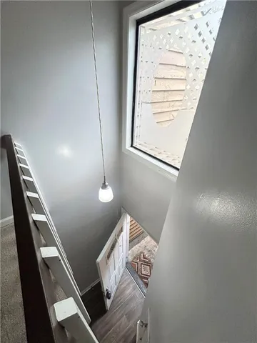 a view of an empty room with stairs