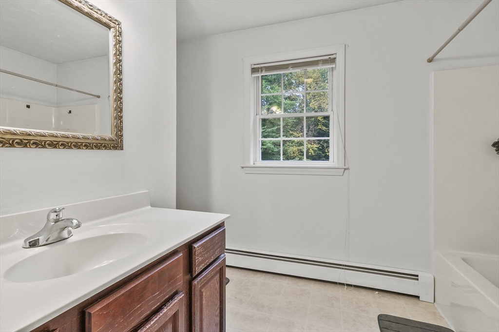 128 Green Farm Road New Ipswich, NH 03071 - Photo 27 of 39 a bathroom with a sink and a mirror