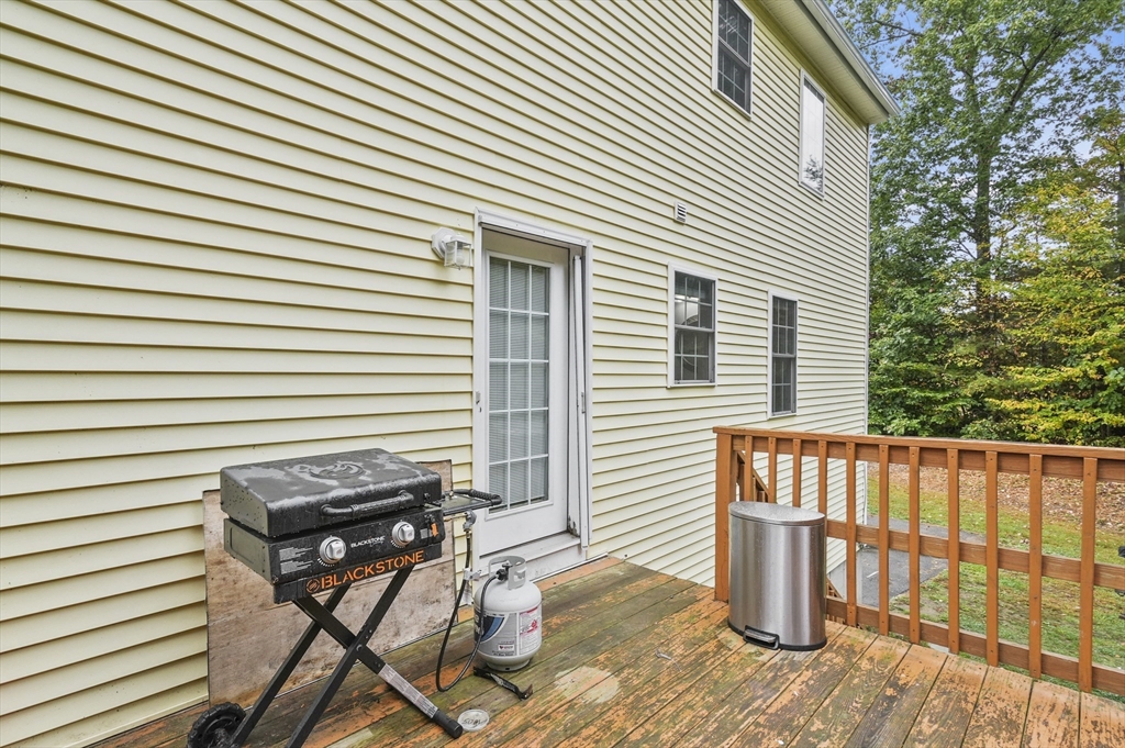 128 Green Farm Road New Ipswich, NH 03071 - Photo 28 of 39 a view of a chair and table in the balcony