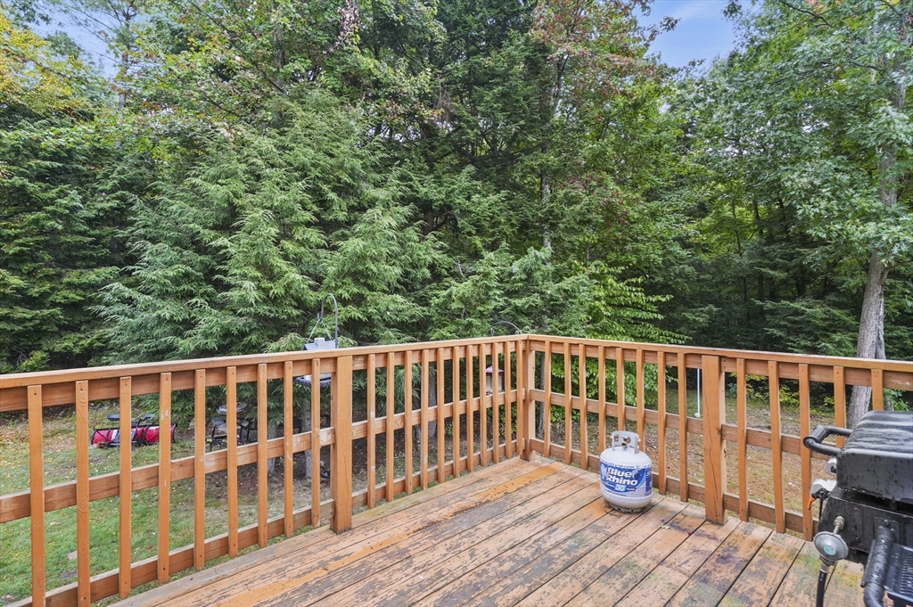 128 Green Farm Road New Ipswich, NH 03071 - Photo 29 of 39 a view of a wooden deck with a yard