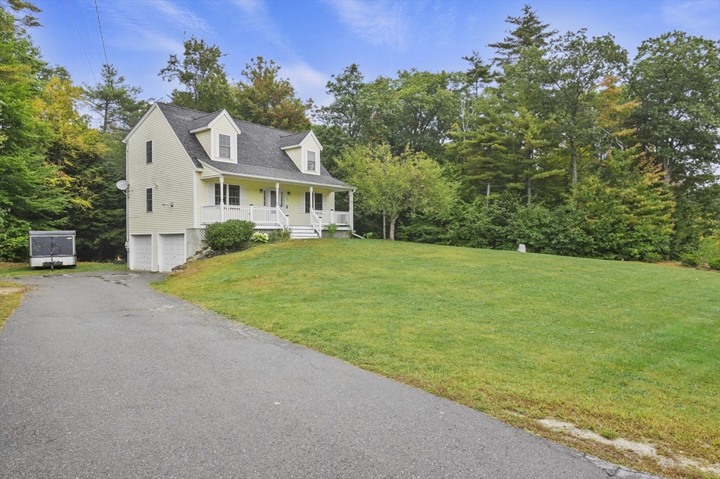 128 Green Farm Road New Ipswich, NH 03071 - Photo 36 of 39 a front view of a house with a garden