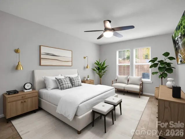 a bedroom with a large bed and a couch