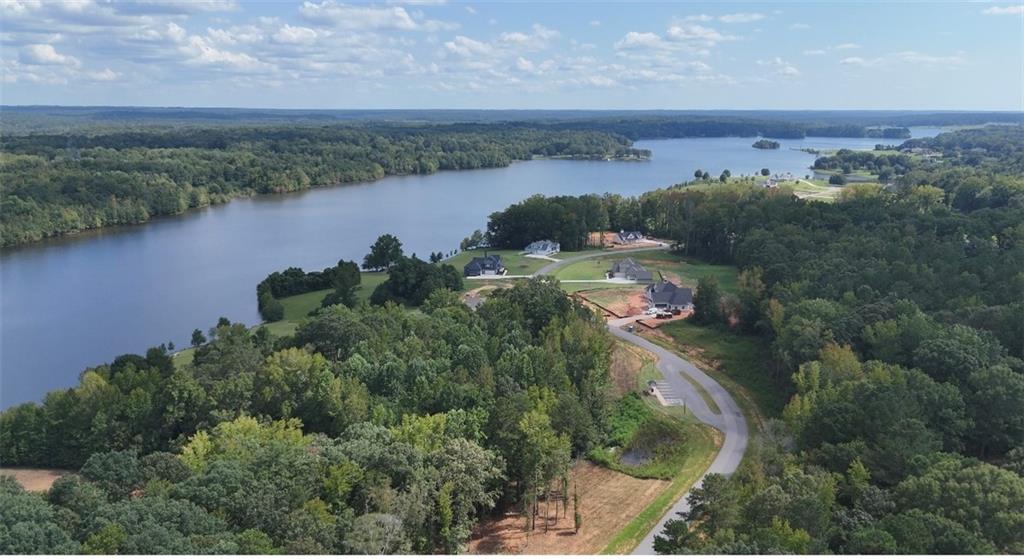 622 Lake Varner Drive Covington, GA 30014 - Photo 8 of 10 an aerial view of a residential houses with outdoor space and lake view