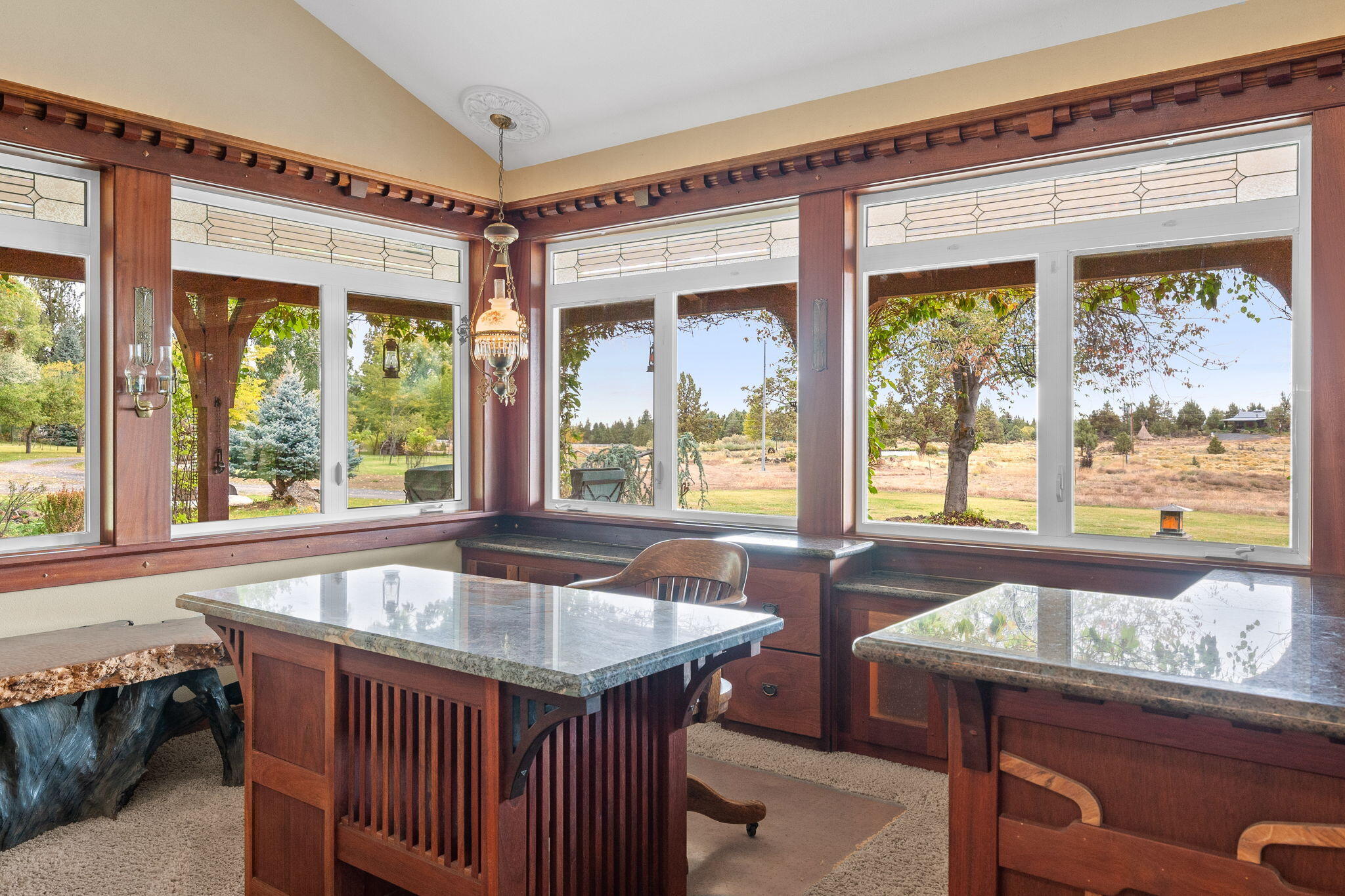 21925 Bear Creek Road Bend, OR 97702 - Photo 11 of 104 a table and chairs in a room next to a window