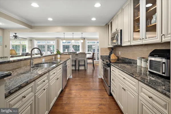 a view of a dining room with furniture and wooden floor