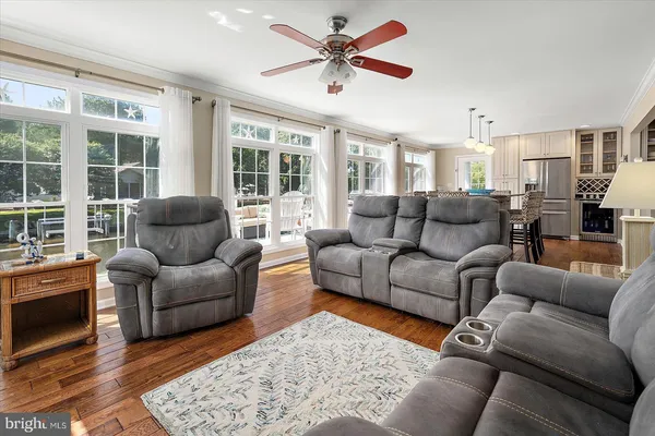 a bedroom with a bed and painting on the wall