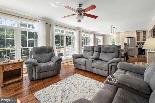 a bedroom with a bed and painting on the wall