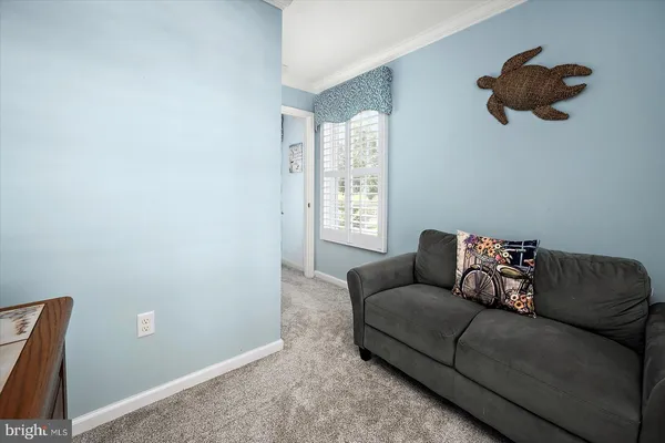 a bedroom with a bed and a dresser in it