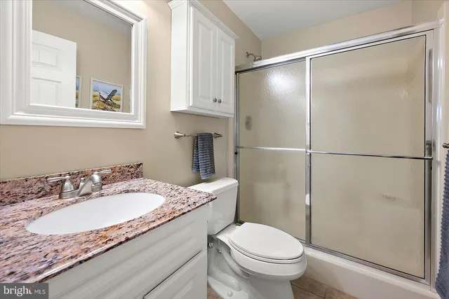 a spacious bedroom with a bed and a window