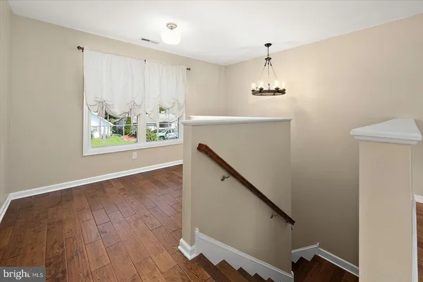 a bedroom with a bed and cabinets
