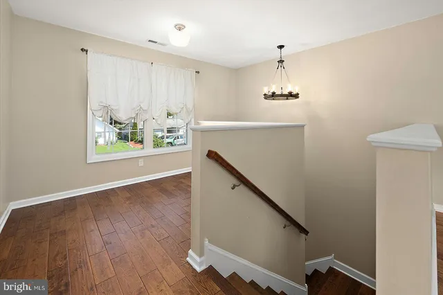 a bedroom with a bed and cabinets