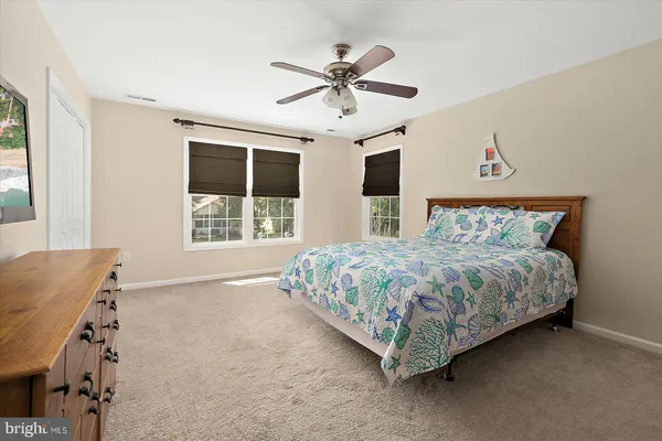 a view of a patio with couches under an umbrella