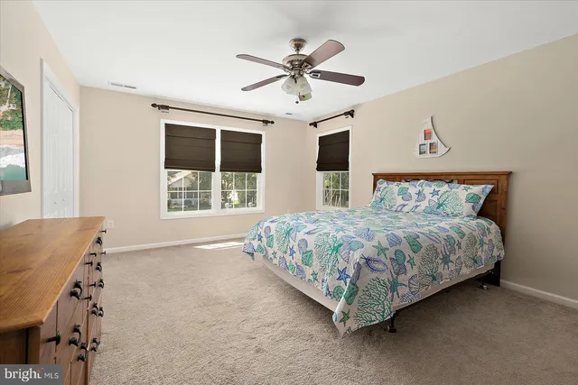 a view of a patio with couches under an umbrella