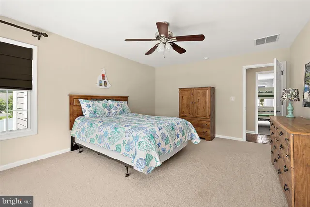 a view of a lake with a yard and a trees