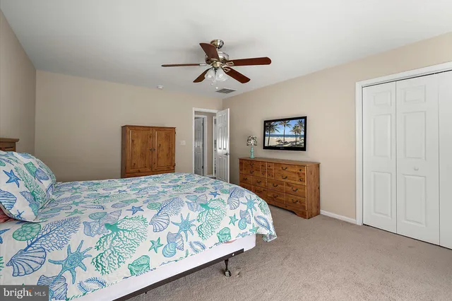 a view of a lake with wooden deck and outdoor space