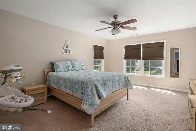 a view of a house with yard and sitting area