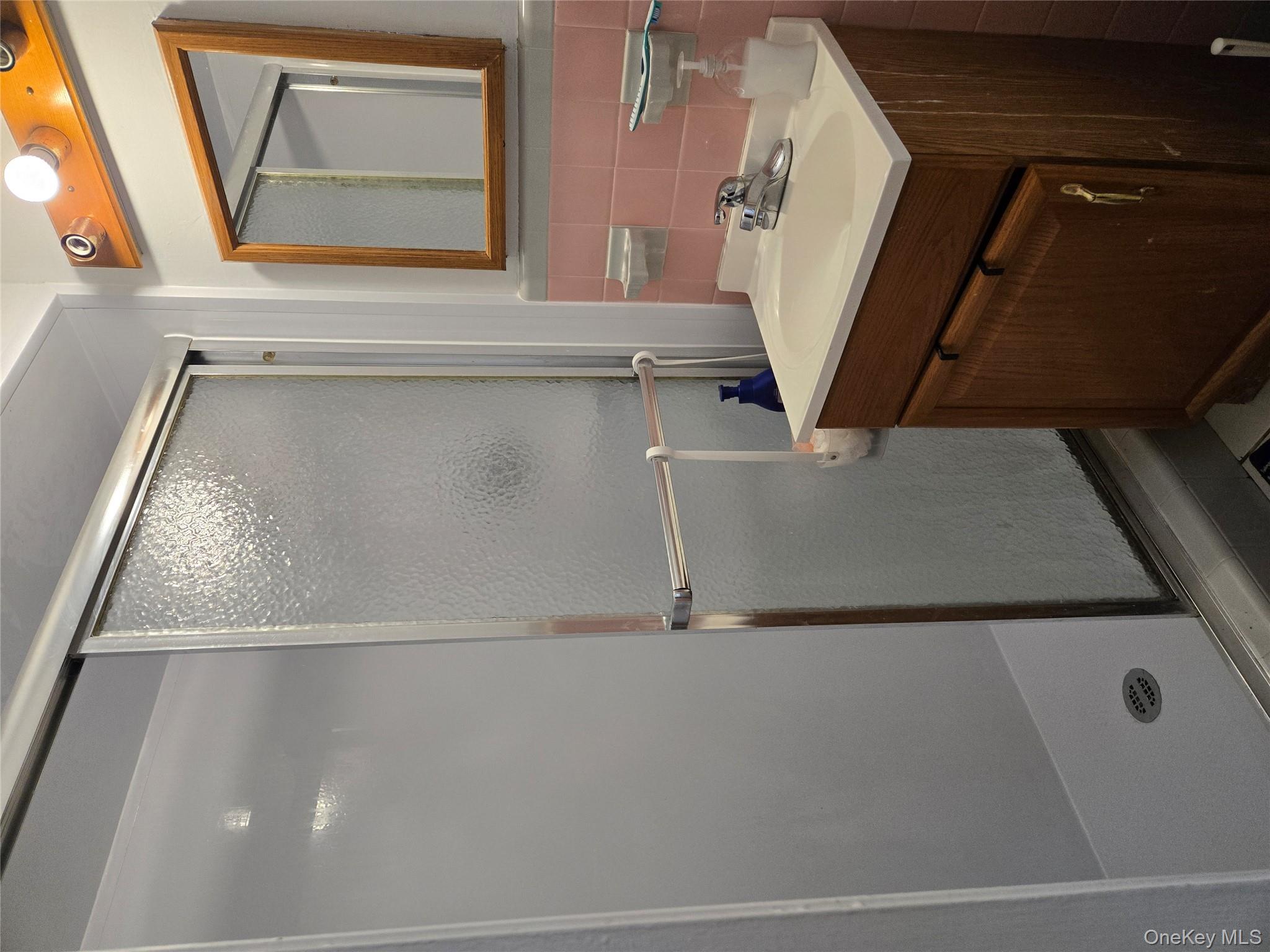 23 Pasture Lane Poughkeepsie, NY 12603 - Photo 12 of 30 a bathroom with a sink vanity and mirror