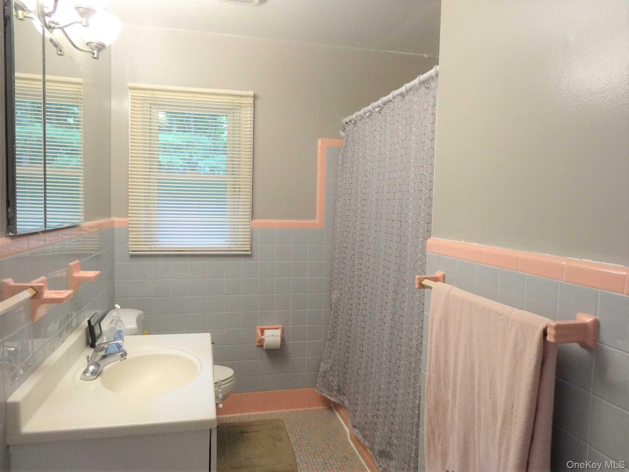 23 Pasture Lane Poughkeepsie, NY 12603 - Photo 15 of 30 a bathroom with a sink and a mirror
