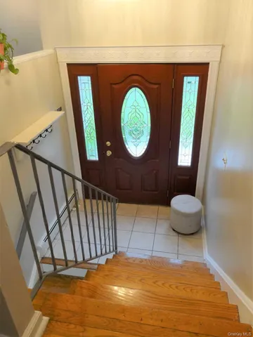 a bathroom with a toilet and a mirror