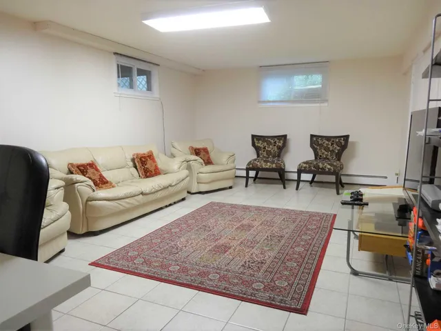 a living room with furniture and a rug