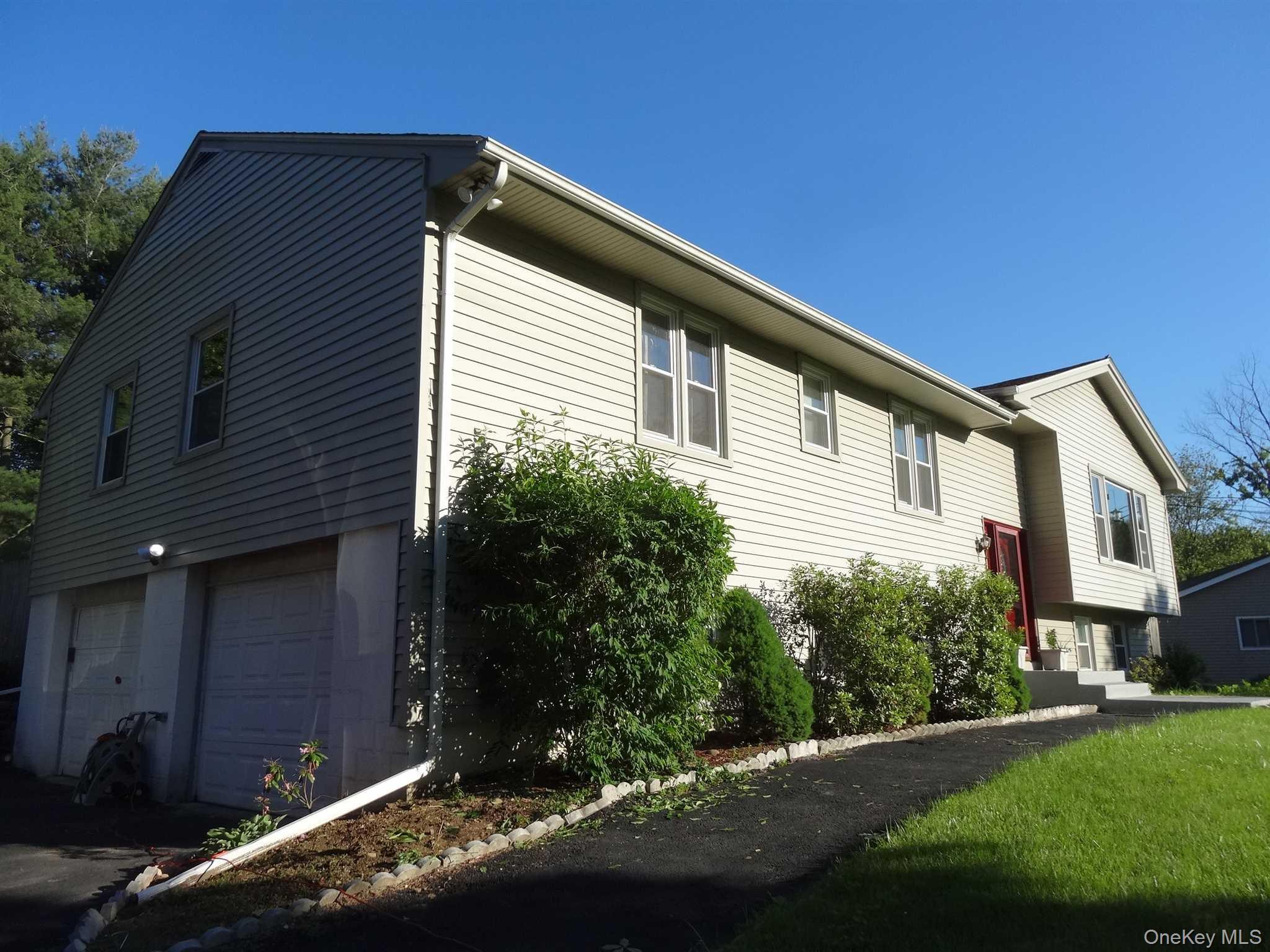 23 Pasture Lane Poughkeepsie, NY 12603 - Photo 2 of 30 a front view of a house with a yard