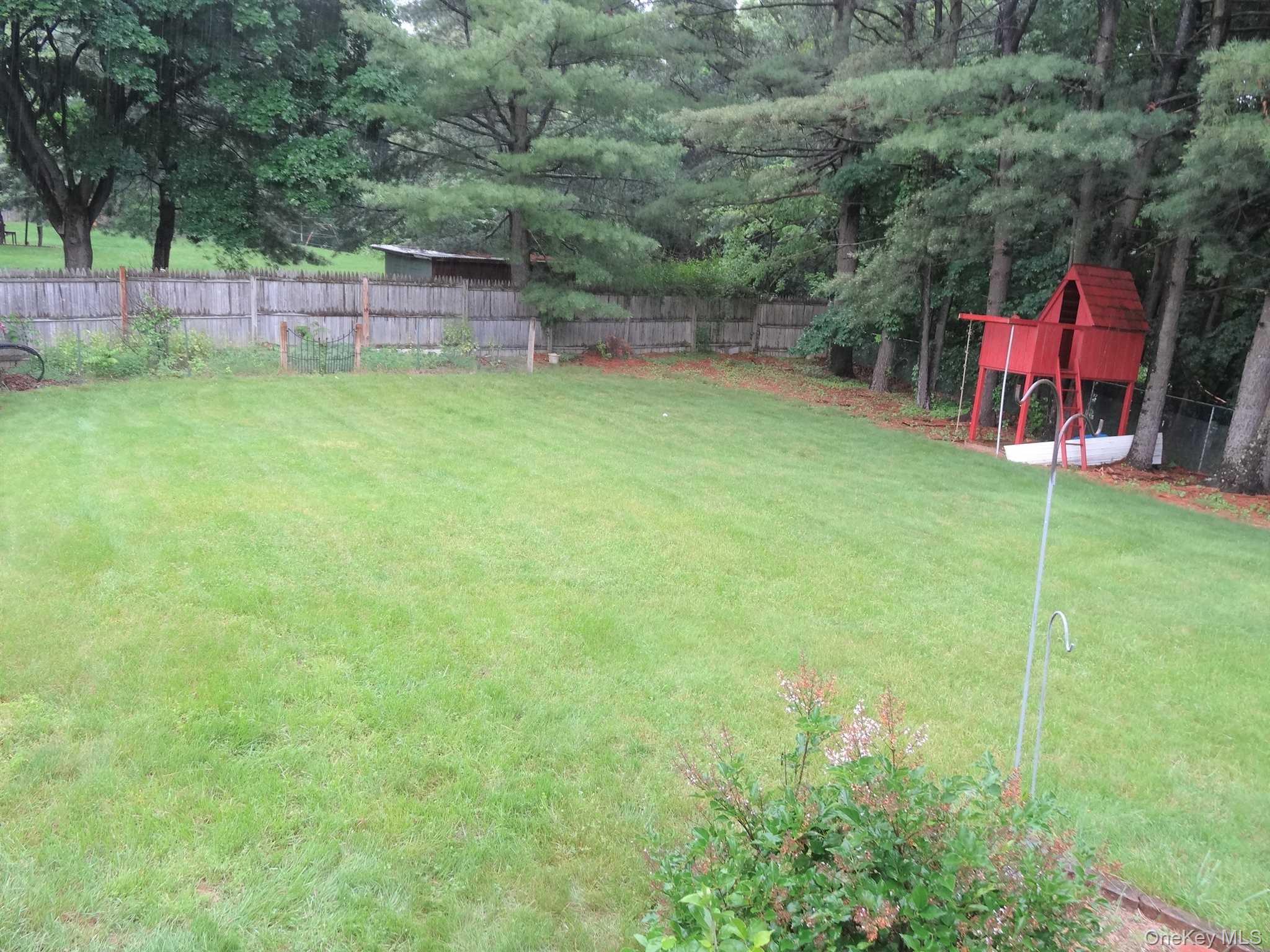 23 Pasture Lane Poughkeepsie, NY 12603 - Photo 27 of 30 a view of a backyard with a small cabin