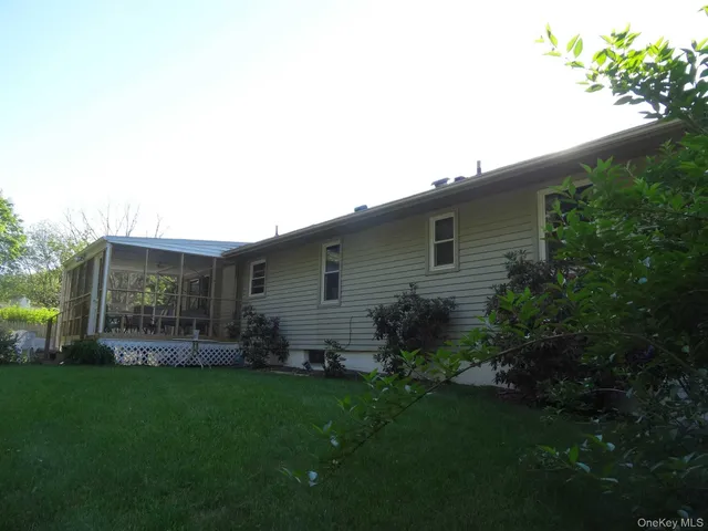a backyard of a house with lots of green space