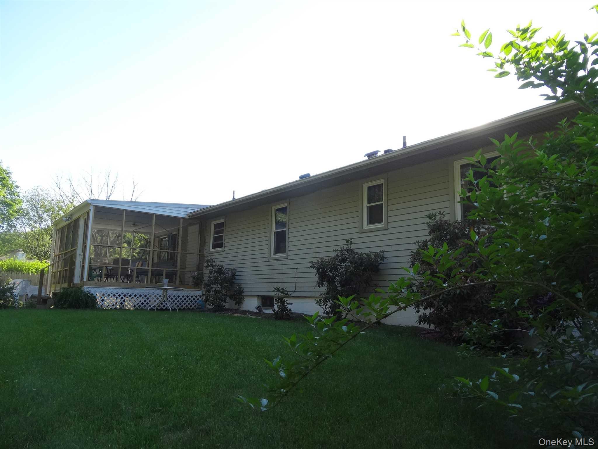 23 Pasture Lane Poughkeepsie, NY 12603 - Photo 29 of 30 a backyard of a house with lots of green space