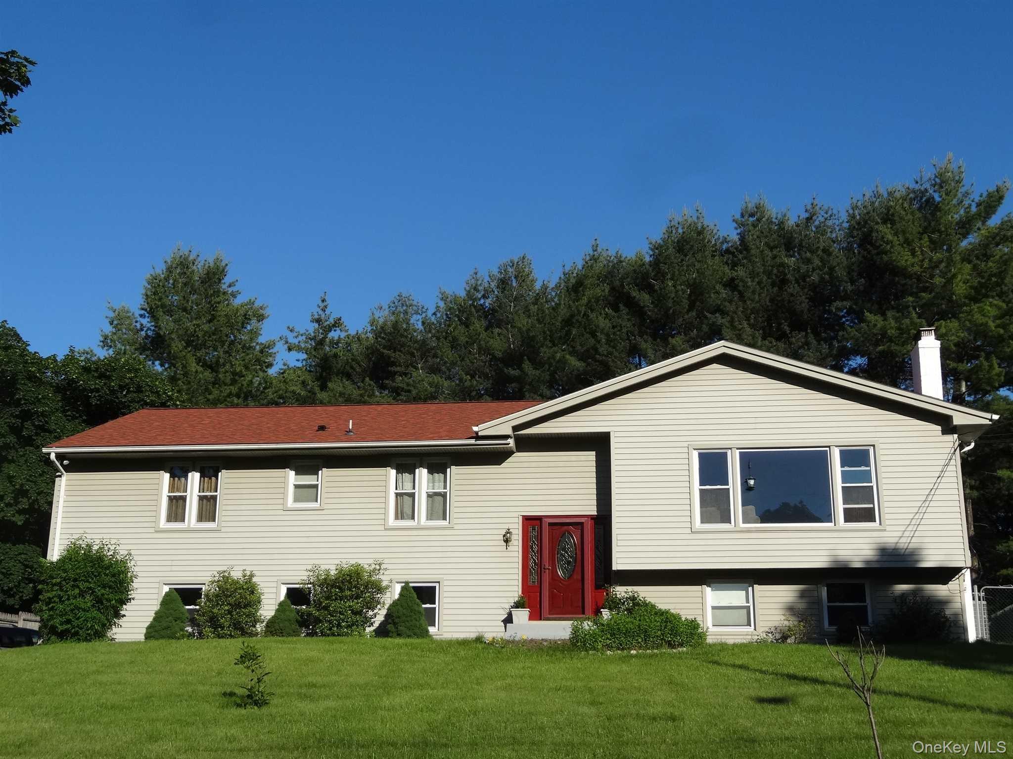 23 Pasture Lane Poughkeepsie, NY 12603 - Photo 30 of 30 a view of a yard in front of a house with plants and large tree