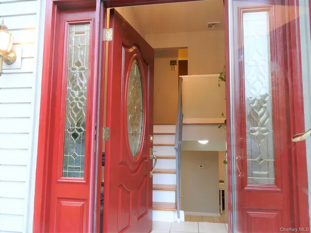 a view of a bathroom with a bathtub and door