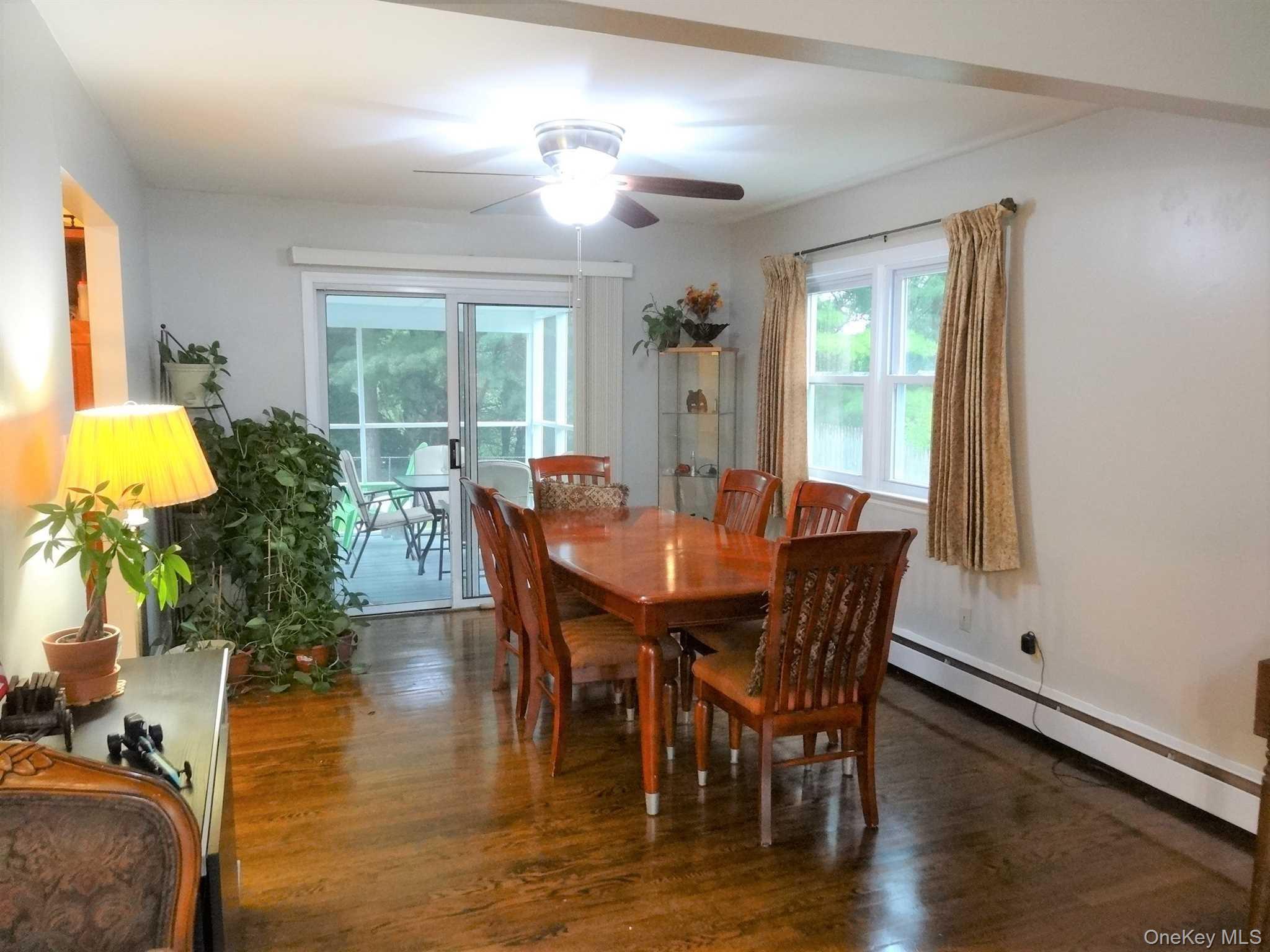 23 Pasture Lane Poughkeepsie, NY 12603 - Photo 7 of 30 a view of a dining room with furniture and wooden floor