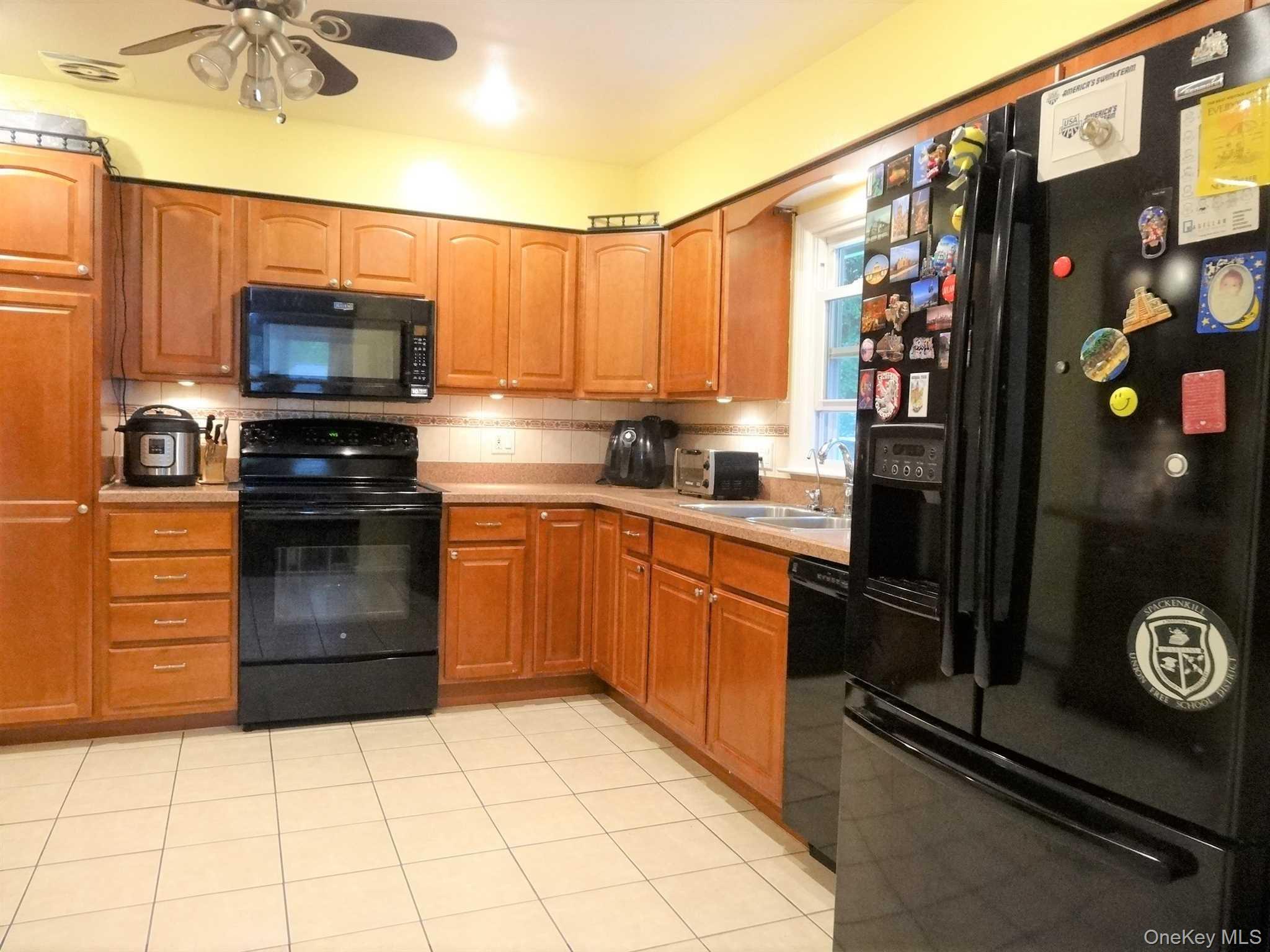 23 Pasture Lane Poughkeepsie, NY 12603 - Photo 9 of 30 a kitchen with stainless steel appliances granite countertop a refrigerator and a stove top oven