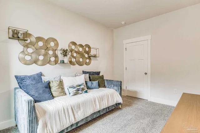 a bedroom with a bed and a couch